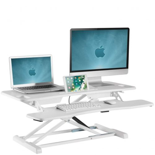 Large sit stand desk converter with three screens on it